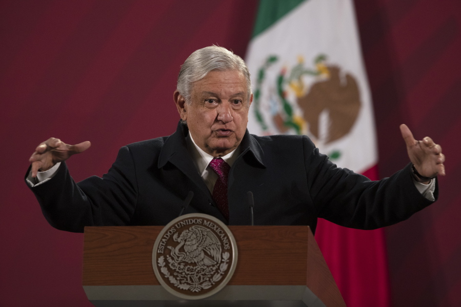 FILE - In this Dec. 18, 2020 file photo, Mexican President Andres Manuel Lopez Obrador gives his daily, morning news conference at the presidential palace, Palacio Nacional, in Mexico City. Mexico President Andres Manuel Lopez Obrador says he has tested positive for COVID-19 and is under medical treatment, Sunday, Jan. 24, 2021.