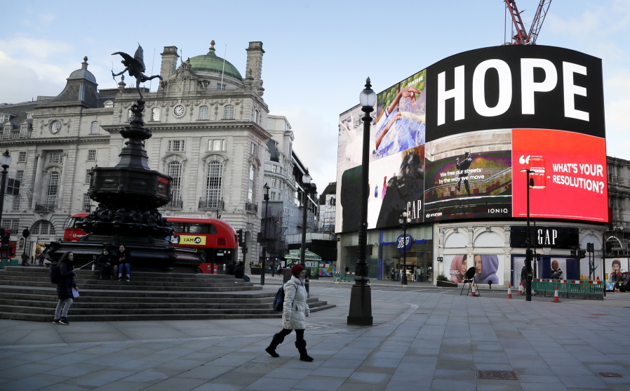 An advert shows the word &#039;Hope&#039; at an unusually quiet Piccadilly Circus, in the normally busy tourist and sightseeing area of London, Wednesday, Jan. 6, 2021. Britain&#039;s Prime Minister Boris Johnson has ordered a new national lockdown for England which means people will only be able to leave their homes for limited reasons, with measures expected to stay in place until mid-February.