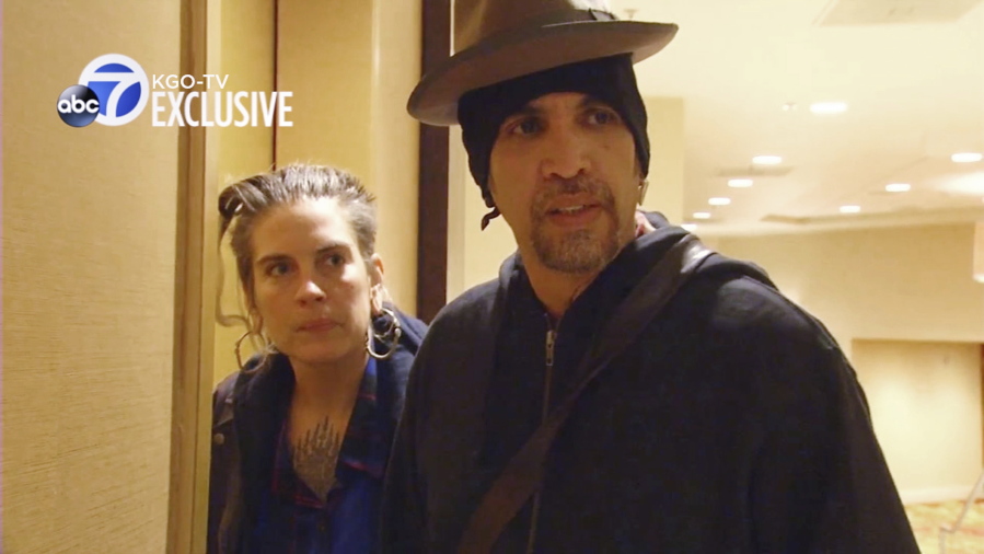 FILE - This file photo from exclusive video provided by San Francisco TV station KGO-TV, made late Sunday, Dec. 4, 2016, shows Derick Ion Almena, right, and Micah Allison, the couple who operated the Ghost Ship warehouse where dozens died in a fire, at an Oakland, Calif., courthouse. Almena, facing a second trial after a 2016 fire killed 36 partygoers at a San Francisco Bay Area warehouse he&#039;s accused of illegally converting into a cluttered artists enclave, is expected to plead guilty later this month, relatives of several of the victims said. Almena, 50, is expected to plead guilty to 36 counts of involuntary manslaughter on Jan. 22, 2021.