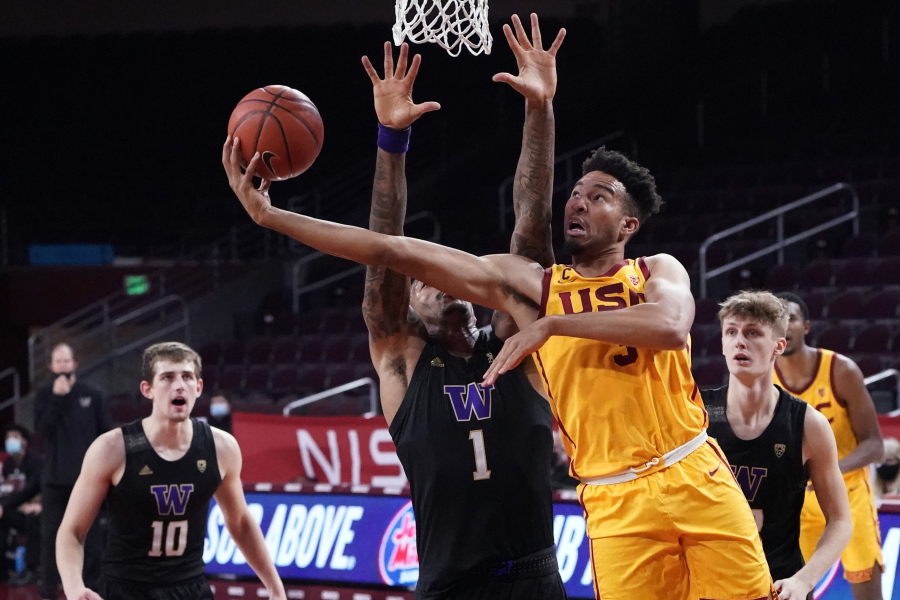 Southern California forward Isaiah Mobley, right, scores over Washington forward Nate Roberts (1) during the second half of an NCAA college basketball game Thursday, Jan. 14, 2021, in Los Angeles.