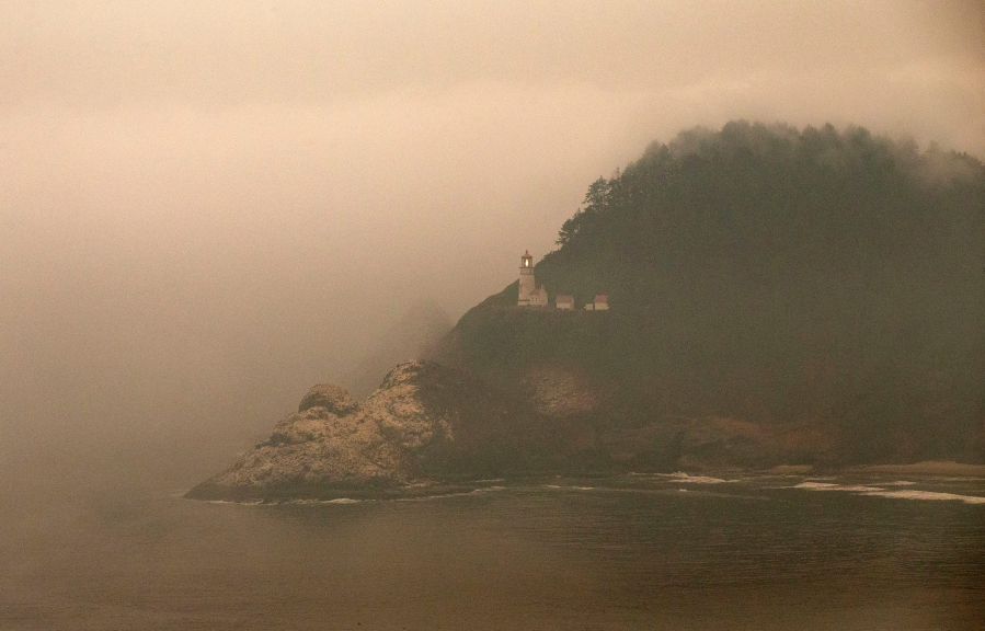 Sep 11, 2020; Yachats, OR, USA; An onshore breeze with fog begins to push away wildfire smoke inland at the Heceta Head Lighthouse won the Oregon coast.