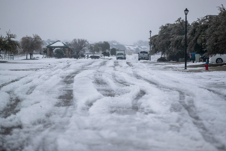 A winter storm that brought snow, ice, and plunging temperatures across Central Texas shut down roads and caused the electrical grid to shut down, leaving thousands of people without power. (Ricardo B.