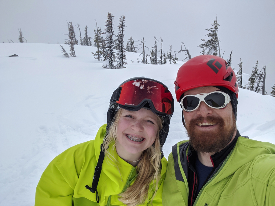 Kelly and Edward Moellmer smile during a backcountry skiing trip in 2020.