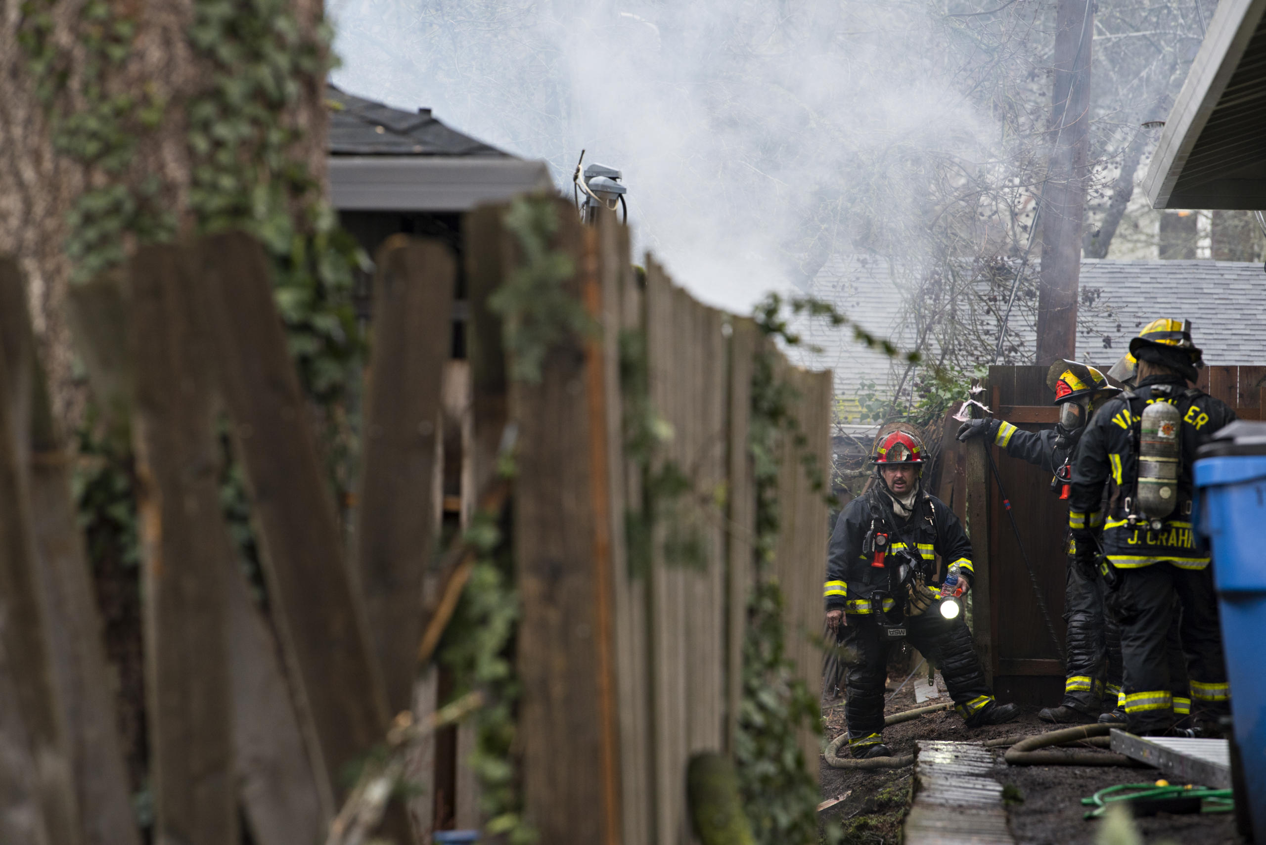 LEADSHOT Firefighters respond to a blaze in two units at the Logan's Court duplex complex in Vancouver's Lincoln neighborhood on Monday afternoon, Feb. 22, 2021.