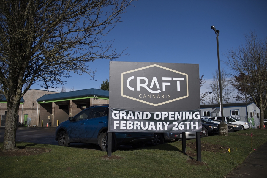 A sign advertises the new Craft Cannabis location in northeast Vancouver. The shop is on a site formerly occupied by a car wash and is operating out of a temporary building. The owners plan to tear down the old car wash building and build a new commercial space for the store.