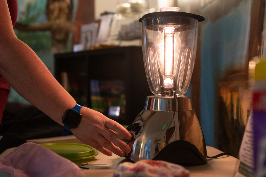 Terra Heilman, Repair Clark County coordinator at Columbia Springs, shows off a blender that has been repurposed as a lamp by a volunteer. She will host a March 1 virtual show-and-tell of upcycled items as part of Clark County&#039;s WasteBusters Challenge.