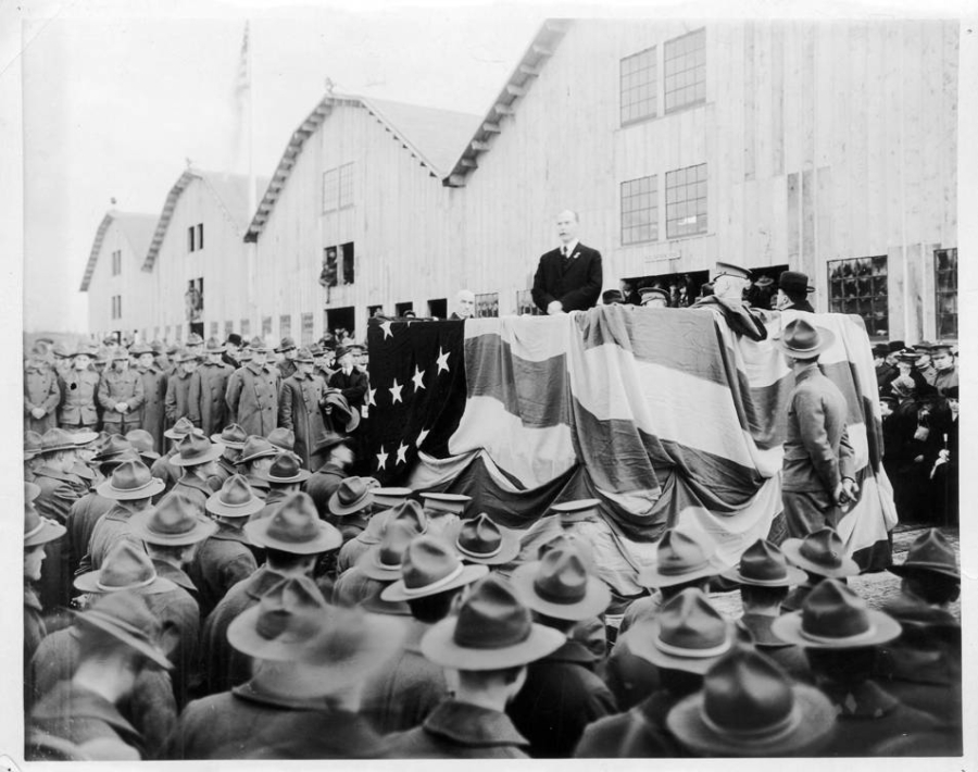 Mayor Percival addresses 8,000 soldiers in front of the recently completed Spruce Production Mill in February 1918. The mill processed the lightweight, flexible wood needed for planes. Of the crowd attending, 2,400 soldiers worked at the mill. The rest came from around the Pacific Northwest. The Spruce Production Division commanded 25,000 soldiers. Three years after his speech before this crowd, well-liked Mayor Percival disappeared, throwing all of Clark County into a tizzy.