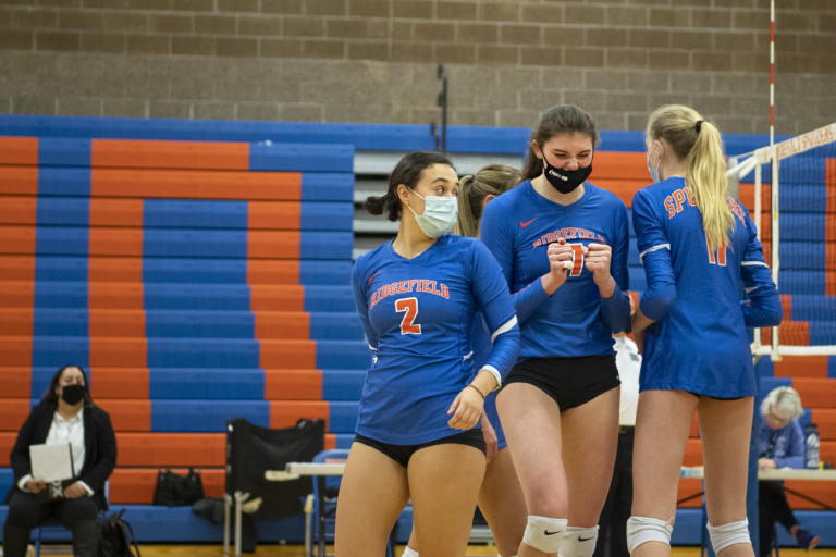 Ridgefield’s Kohana Fukuchi, left, looks back toward Ali Andrew, center, who shows frustration over reading a lob hit wrong on Tuesday, February 16, 2021, at Ridgefield High School. Ridgefield won 25-20, 25-9, 25-12 over Mark Morris in its first volleyball match since winning the 2A State Championship in fall 2019.