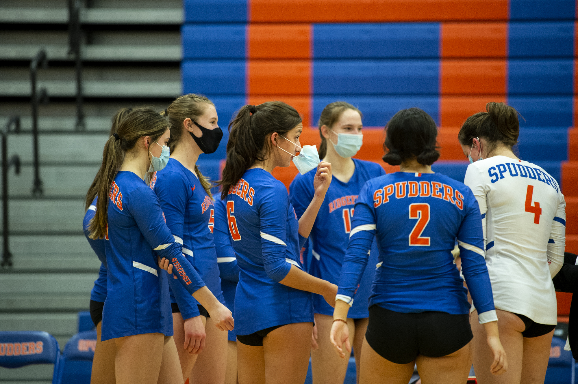 Ridgefield’s Presley McCaskill adjusts her mask during a timeout on Tuesday, February 16, 2021, at Ridgefield High School. Ridgefield won 25-20, 25-9, 25-12 over Mark Morris in its first volleyball match since winning the 2A State Championship in fall 2019.