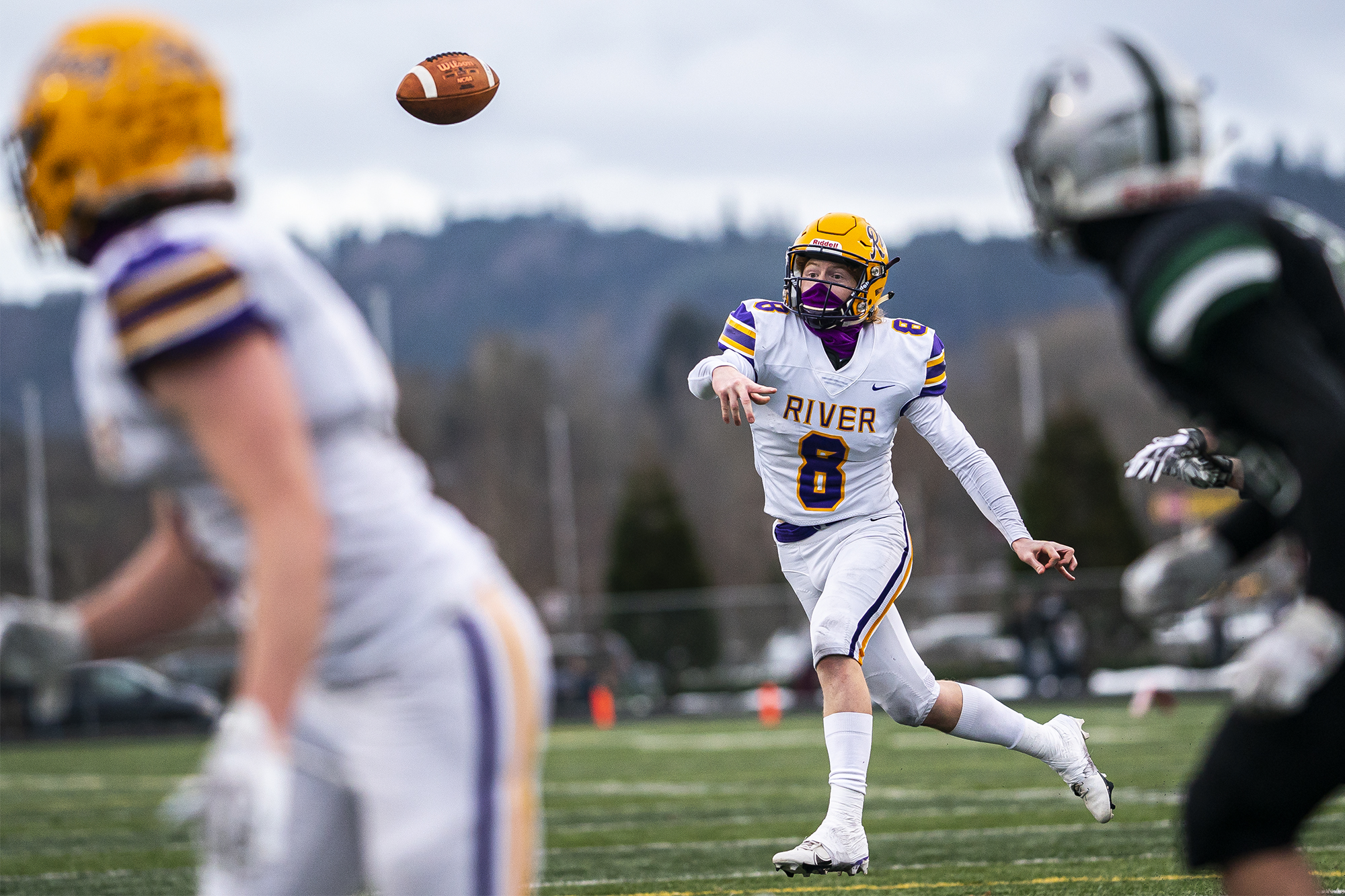 Columbia River's Mason Priddy completes a pass fora. Touchdown against Woodland during a season opener game at Woodland High School on Saturday night, Feb. 20, 2021.