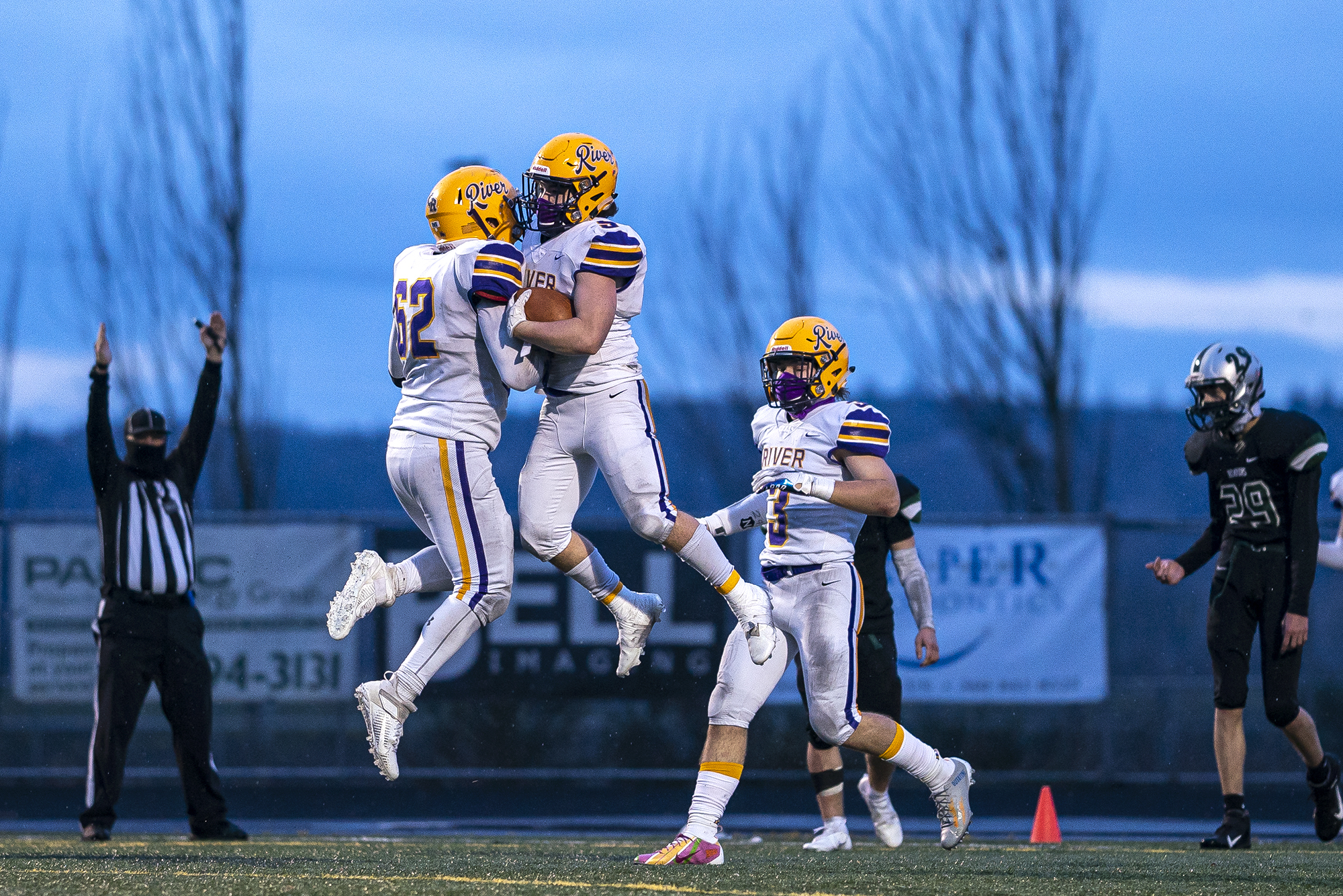 Columbia River celebrates in the end zone before a penalty took back the touchdown during a season opener game at Woodland High School on Saturday night, Feb. 20, 2021.