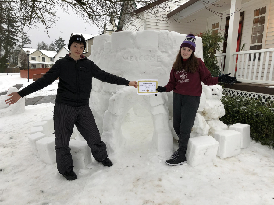 EAST VANCOUVER: Karina and Sullivan May built a big snow fort outside of their home.
