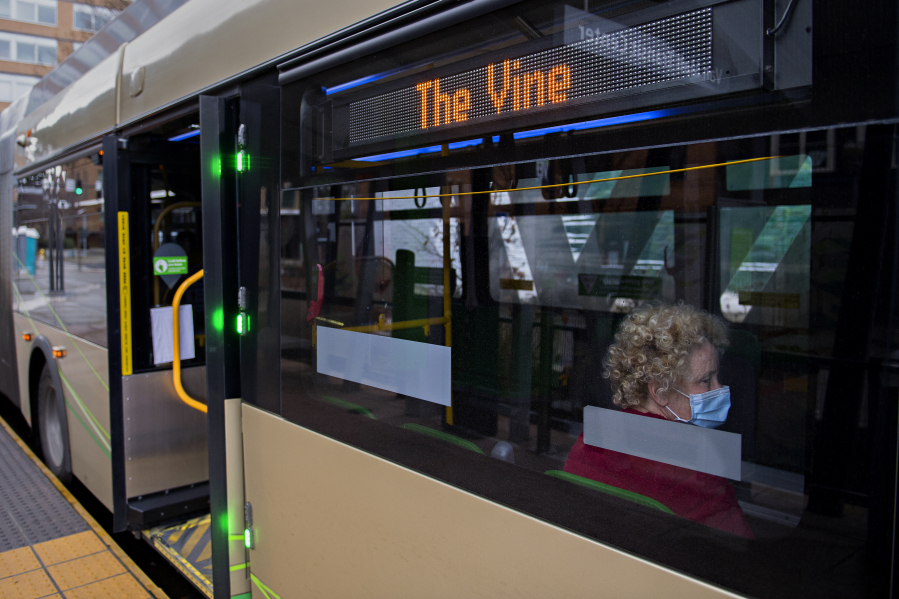 Heather Manning of Vancouver sits aboard a C-Tran Vine bus headed east while departing from the Turtle Place Transit Station in downtown Vancouver on Monday. The Vine runs along Fourth Plain Boulevard and is Vancouver&#039;s first Bus Rapid Transit line, though two more are in the works.