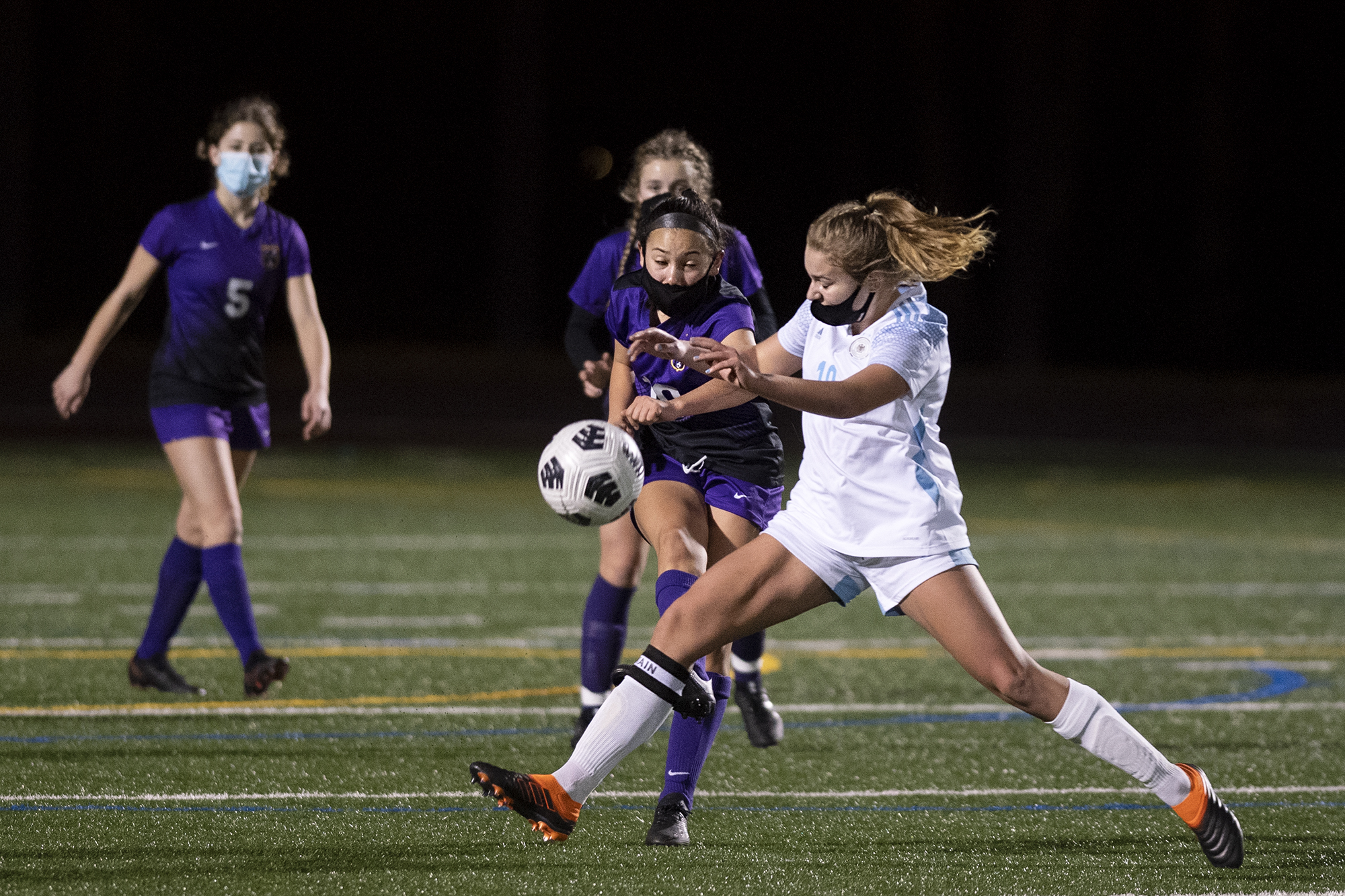 Columbia River’s Andie Buckley passes it past the defense of Hockinson’s Payton Lawson on Saturday, February 27, 2021, at Columbia River High School. The Hawks earned a 1-0 victory over Columbia River in a rematch of the 2019 2A State girls soccer championship.