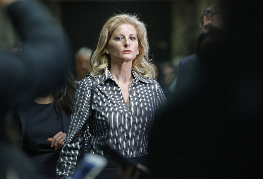 FILE - In this Dec. 5, 2017, file photo, Summer Zervos leaves Manhattan Supreme Court at the conclusion of a hearing in New York. The former &quot;Apprentice&quot; contestant is trying to get her defamation lawsuit against former President Donald Trump moving again now that he&#039;s no longer president.