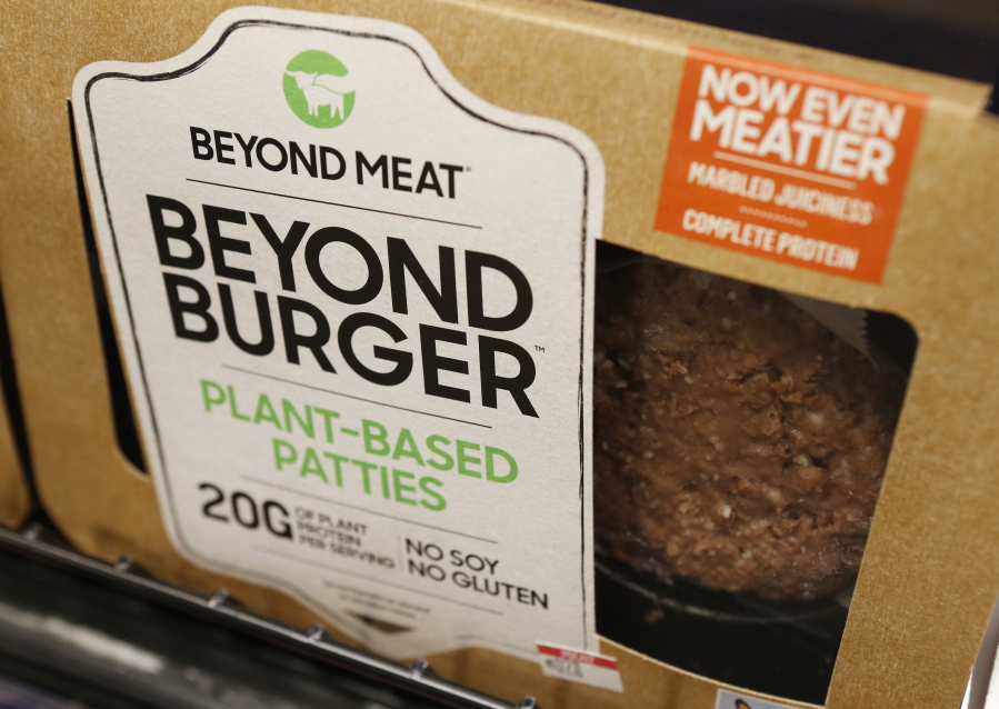 FILE - In this June 27, 2019, file photo, a meatless burger patty called Beyond Burger by Beyond Meat is displayed at a grocery store in Richmond, Va. Plant-based food company Beyond Meat will be partnering with several major fast food chains in the coming years to expand offerings that could eventually include plant-based burgers, chalupas or toppings on a stuffed-crust pizza. They announced on Thursday, Feb. 25, 2021, distribution agreements with McDonald&#039;s as well as with Yum Brands, the parent company of KFC, Taco Bell and Pizza Hut.