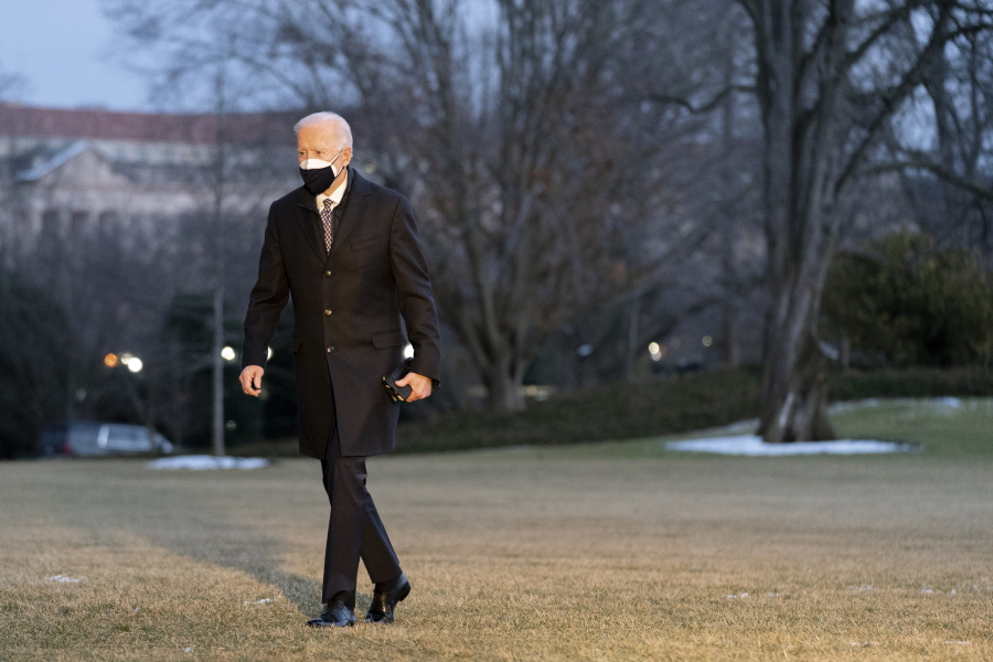 President Joe Biden walks on the South Lawn of the White House after stepping off Marine One, Friday, Feb. 19, 2021, in Washington. Biden is returning to Washington after visiting Pfizer&#039;s COVID-19 vaccine manufacturing site near Kalamazoo, Mich.