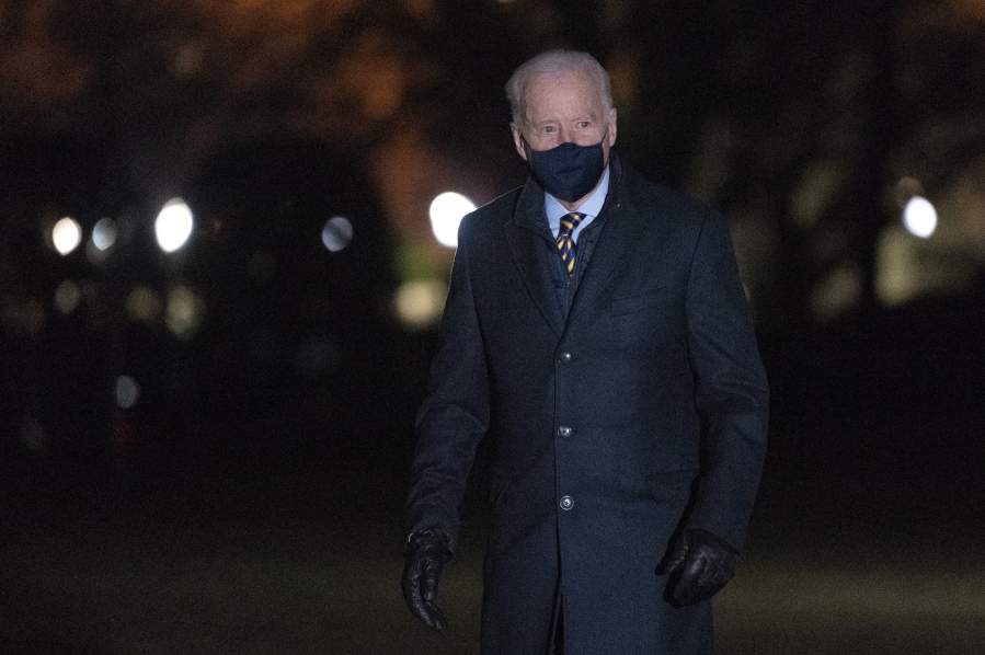 President Joe Biden walks on the South Lawn of the White House after stepping off Marine One, Wednesday, Feb. 17, 2021, in Washington. Biden was returning to Washington after participating in a town hall event in Wisconsin.