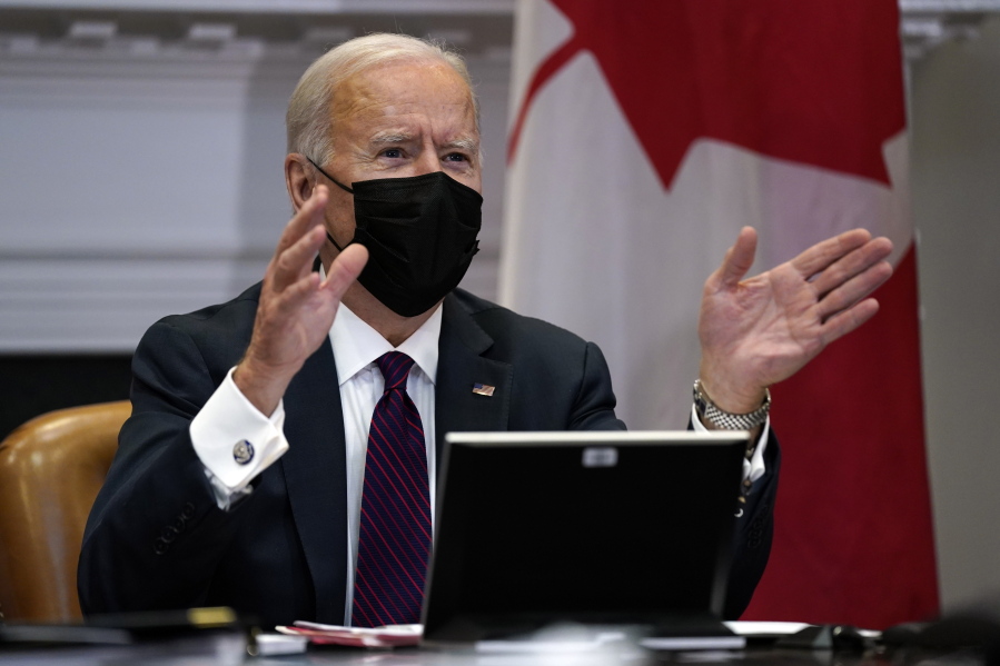 President Joe Biden holds a virtual bilateral meeting with Canadian Prime Minister Justin Trudeau, in the Roosevelt Room of the White House, Tuesday, Feb. 23, 2021, in Washington.