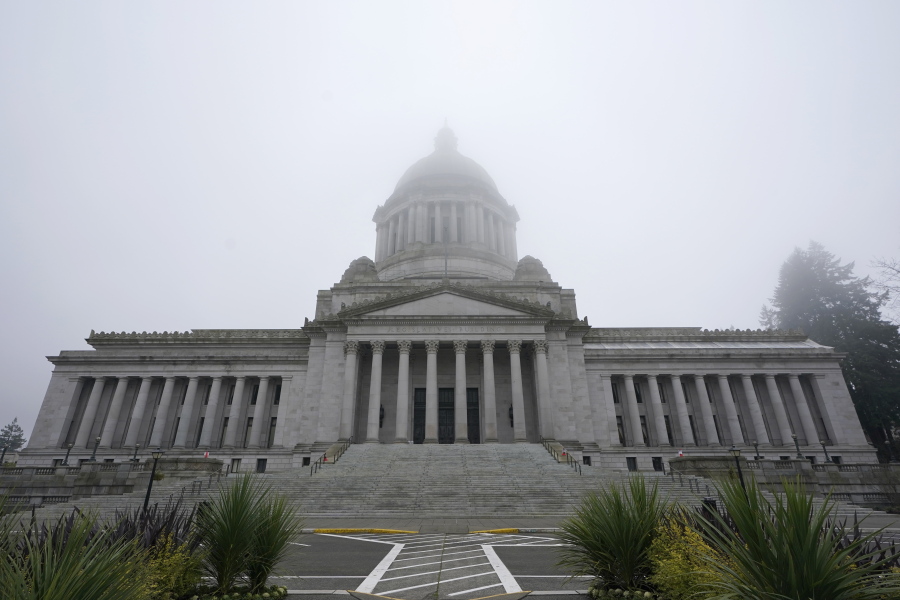 The Legislative Building is shown partially shrouded in fog at the Capitol in Olympia. (AP Photo/Ted S.