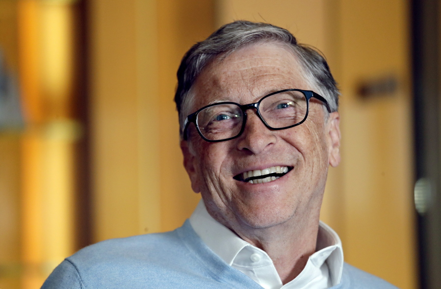 FILE - In this Feb. 1, 2019, file photo, Bill Gates smiles while being interviewed in Kirkland, Wash. Washington state&#039;s richest residents, including Gates and Jeff Bezos, would pay a wealth tax on certain financial assets worth more than $1 billion under a proposed bill whose sponsor says she is seeking a fair and equitable tax code. Under the bill, starting Jan. 1, 2022, for taxes due in 2023, a 1% tax would be levied not on income, but on &quot;extraordinary&quot; assets ranging from cash, publicly traded options, futures contracts, and stocks and bonds.