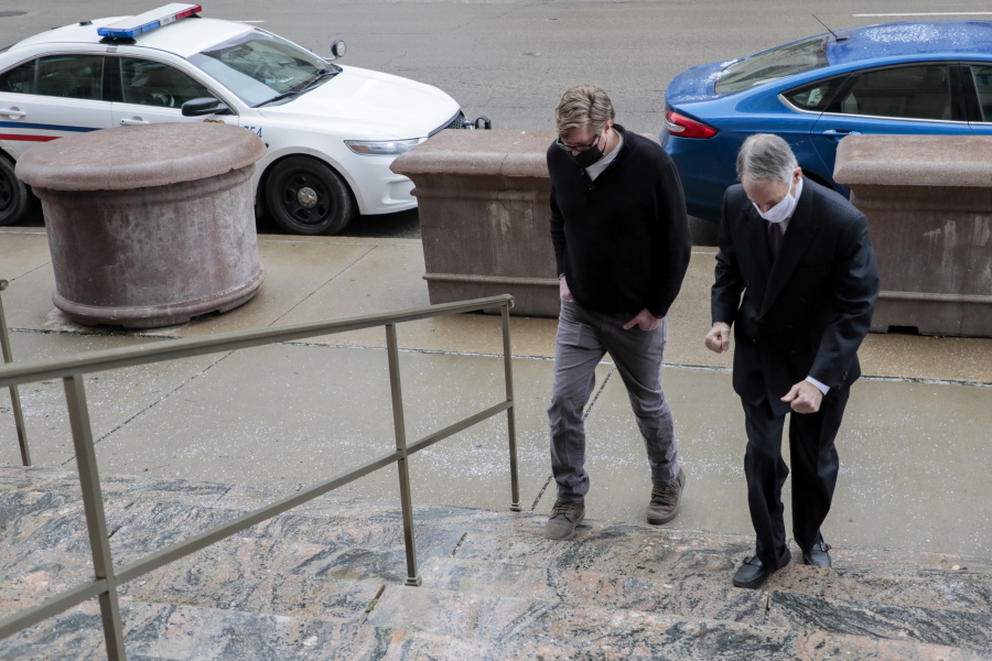 Dustin Thompson, left, of Columbus, who is accused of being part of the Jan. 6 insurrection at the U.S. Capitol, arrives with his lawyer, Sam Shamansky, to turn himself in on Monday, Jan. 25, 2021, at the Joseph P. Kinneary U.S. District Courthouse in Columbus, Ohio. (Joshua A.