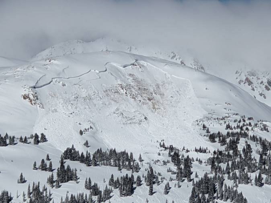 An avalanche that killed an unidentified snowboarder is seen Feb. 14 near the town of Winter Park, Colorado.