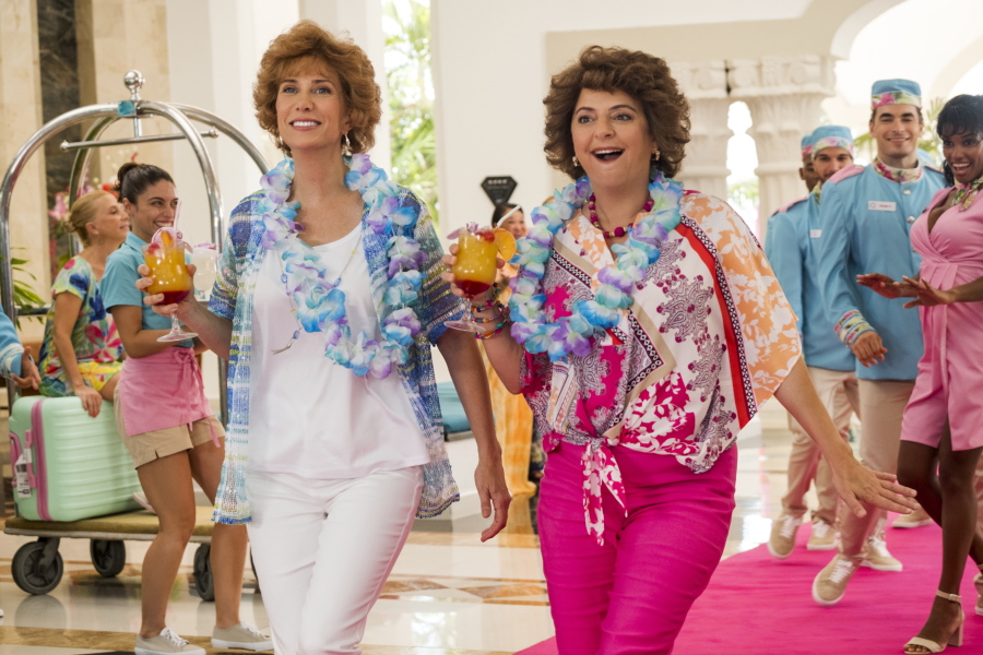 This image released by Lionsgate shows Kristen Wiig, left, and Annie Mumolo in &quot;Barb and Star Go to Vista Del Mar.&quot; (Cate Cameron/Lionsgate via AP) (Cate Cameron/Lionsgate)