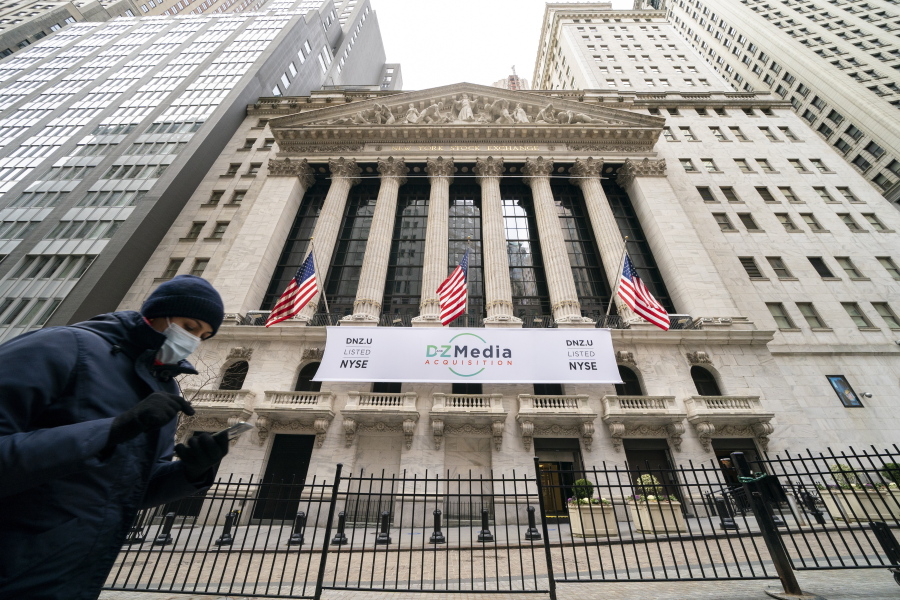 FILE - Pedestrians pass the New York Stock Exchange, Wednesday, Jan. 27, 2021, in New York.  Stocks are opening higher on Wall Street following three straight days of losses. The S&amp;P 500 rose 0.2% in the first few minutes of trading Friday, Feb. 19.