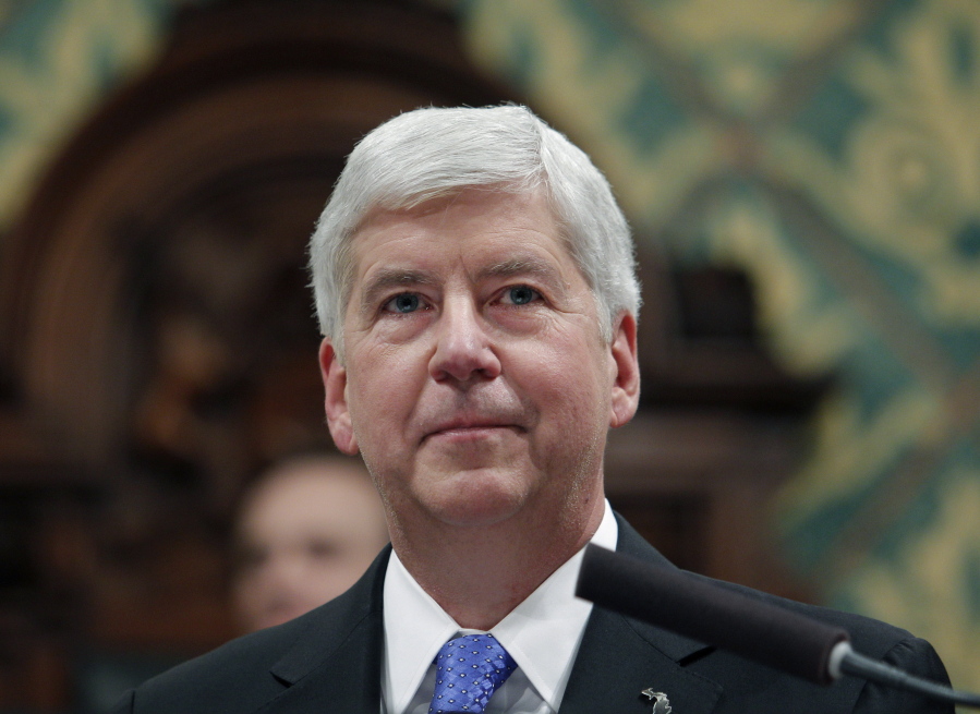 FILE - In this Jan. 23, 2018, file photo, then, Michigan Gov. Rick Snyder delivers his State of the State address at the state Capitol in Lansing, Mich. A pretrial hearing is scheduled Tuesday, Feb. 23, 2021, for Snyder, who is accused of two misdemeanor counts of willful neglect of duty in connection with the lead contamination of drinking water in Flint, Mich., and a fatal outbreak of Legionnaires&#039; disease.