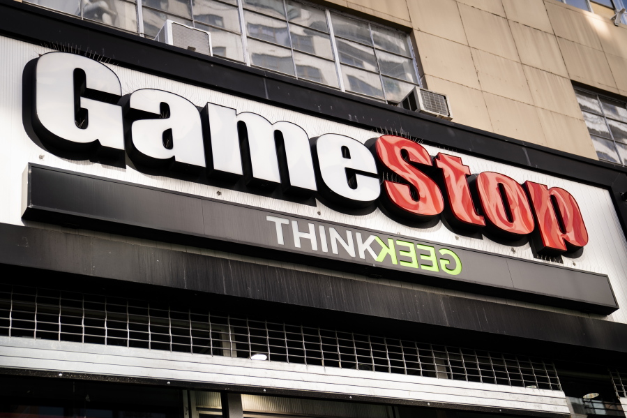 FILE - Pedestrians pass a GameStop store on 14th Street at Union Square, Thursday, Jan. 28, 2021, in the Manhattan borough of New York.    Behind GameStop&#039;s stock surge is the grim reality that the video game retailer is floundering even as the industry around it is booming.  Many investors fully understand the contradiction between GameStop&#039;s stock price and its business fundamentals. But for those who imagine it to be the next Tesla or Amazon, the truth is: It&#039;s likely not.