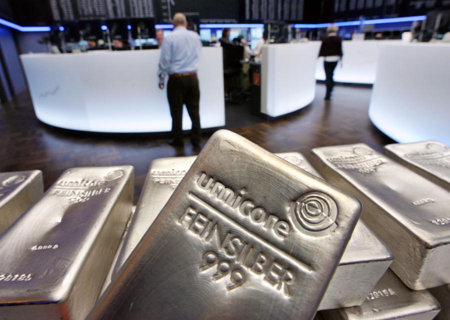 FILE - In this file photo dated Wednesday, May 9, 2007, Silver bullion, bars weighing five kilograms each, are displayed in the trading room of the stock exchange in Frankfurt, Germany.  Silver futures jumped more than 10% on Monday Feb.