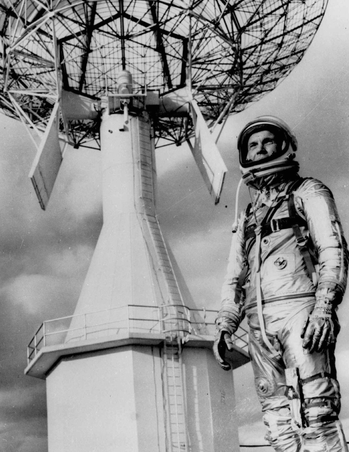 FILE- In this June 18, 1963 file photo astronaut John Glenn, the first American to orbit the earth, posing before a Project Mercury tracking station at Cape Canaveral, Fla. A panel is scheduled to vote Thursday, Feb. 25, 2021, on bringing a statue of the late astronaut and U.S. senator to the Ohio Statehouse to mark major future milestones, such as his birthday and the anniversary of his famous space flight. Glenn died in 2016 at age 95.
