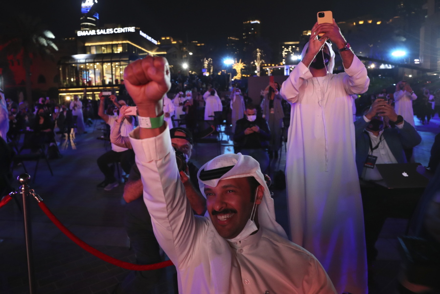 Emiratis celebrate after the Hope Probe enters Mars orbit as a part of Emirates Mars mission, in Dubai, United Arab Emirates, Tuesday, Feb. 9, 2021. The spacecraft from the United Arab Emirates swung into orbit around Mars in a triumph for the Arab world&#039;s first interplanetary mission. It is the first of three robotic explorers arriving at the red planet over the next week and a half.