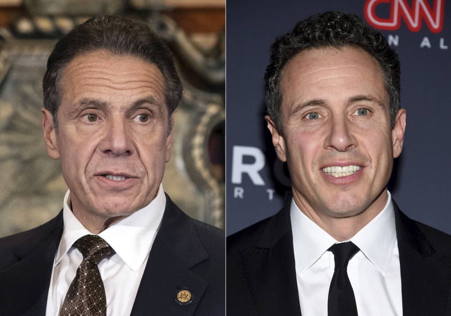 New York Gov. Andrew M. Cuomo, Cuomo appears during a news conference about the COVID-19 vaccine at the State Capitol in Albany, N.Y., on Dec. 3, 2020, left, and CNN anchor Chris Cuomo attends the 12th annual CNN Heroes: An All-Star Tribute at the American Museum of Natural History in New York on Dec. 9, 2018.  CNN said it had reinstated a prohibition on Chris Cuomo interviewing or doing stories about his brother. The policy avoids a conflict of interest or at the very least the appearance of one. (Mike Groll/Office of Governor of Andrew M.