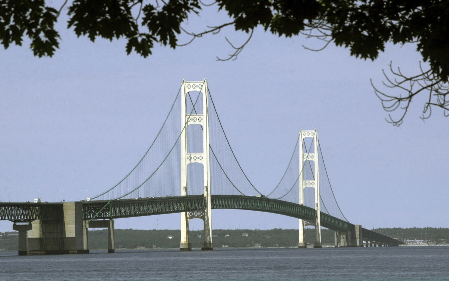 FILE - This July 19, 2002, file photo, shows the Mackinac Bridge that spans the Straits of Mackinac from Mackinaw City, Mich. Michigan&#039;s environmental agency said Friday, Jan. 29, 2021, it had approved construction of an underground tunnel to house a replacement for a controversial oil pipeline in a channel linking two of the Great Lakes.