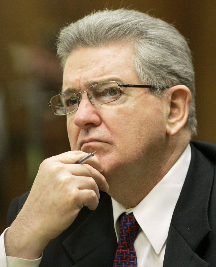 FILE- In this Oct. 15, 2008 file photo, former FBI agent John Connolly listens to the testimony during his trial in Miami. The imprisoned former FBI agent serving a 40-year prison sentence for alerting former Boston mobster Whitey Bulger that he could implicated in a mob murder wants to be released from prison on medical grounds. Connolly will ask the Florida Commission on Offender Review Wednesday, Feb. 17, 2021 to release him.