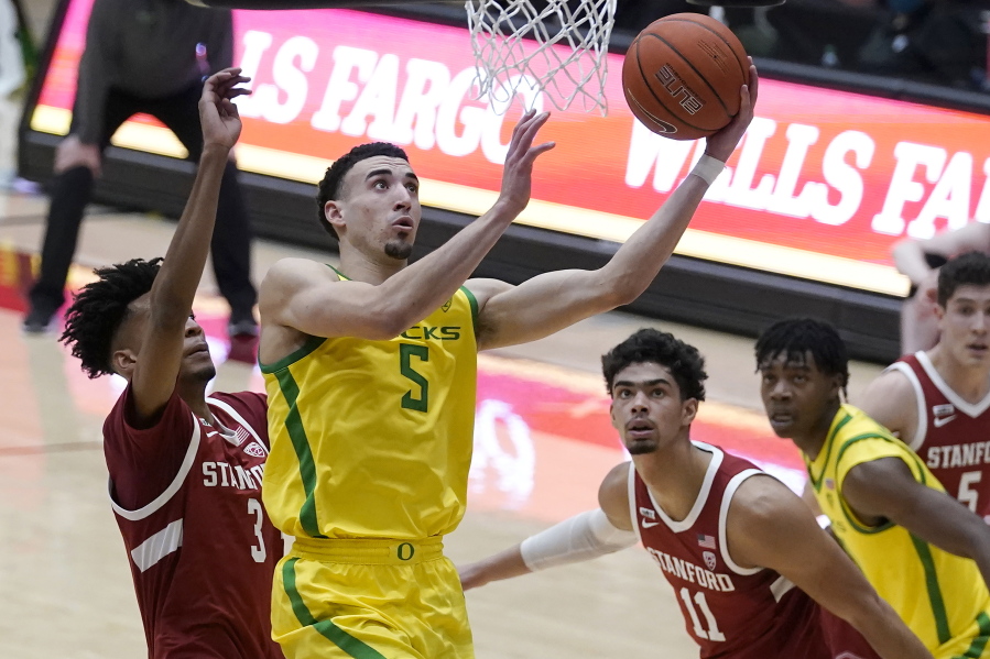 Oregon guard Chris Duarte (5) shoots in front of Stanford forwards Ziaire Williams (3) and Jaiden Delaire (11) during the first half of an NCAA college basketball game in Stanford, Calif., Thursday, Feb. 25, 2021.