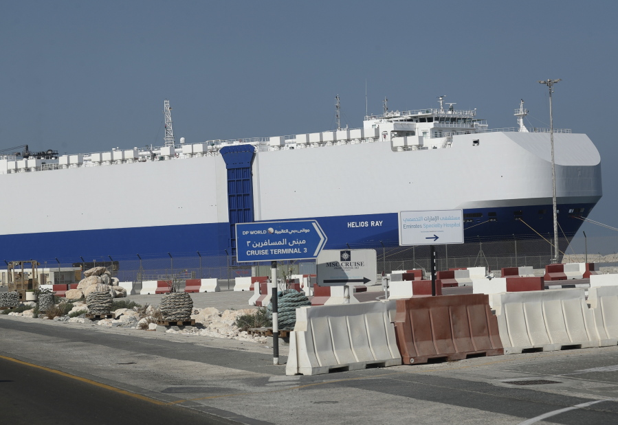 The Israeli-owned cargo ship, Helios Ray, sits docked in port after arriving earlier in Dubai, United Arab Emirates, Sunday, Feb. 28, 2021. The ship has been damaged by an unexplained blast at the gulf of Oman on Thursday.