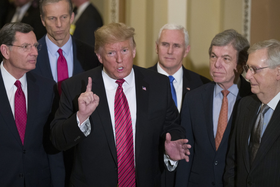 FILE - In this Wednesday, Jan. 9, 2019 file photo, Sen. John Barrasso, R-Wyo., left, and Sen. John Thune, R-S.D., stand with President Donald Trump, Vice President Mike Pence, Sen. Roy Blunt, R-Mo., and Senate Majority Leader Mitch McConnell of Ky., as Trump speaks while departing after a Senate Republican Policy luncheon, on Capitol Hill in Washington. The Republican Party still belongs to Donald Trump. The GOP privately flirted with purging the norm-shattering former president after he incited a deadly riot at the U.S. Capitol last month. But in the end, only seven of 50 Senate Republicans voted to convict Trump in his historic second impeachment trial on Saturday, Feb. 13, 2021.