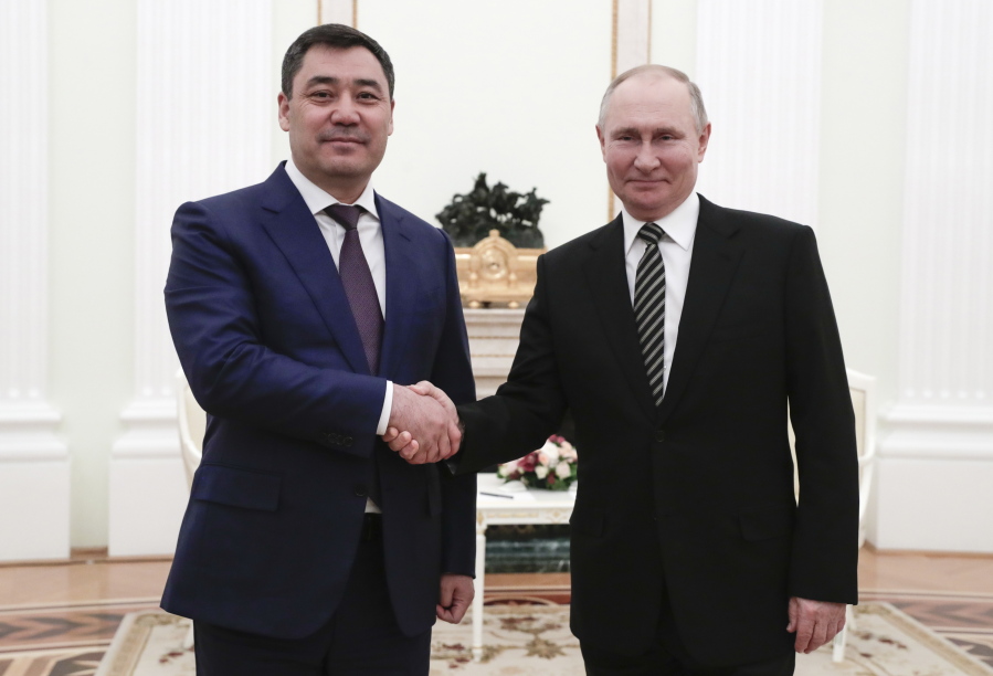 Russian President Vladimir Putin, right, shake hands with Kyrgyzstan&#039;s President Sadyr Japarov during their meeting in Moscow, Russia, Wednesday, Feb. 24, 2021.