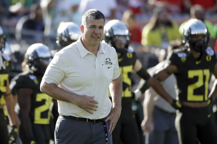 FILE - Oregon head coach Mario Cristobal watches during warm ups before the Rose Bowl NCAA college football game against Wisconsin, in Pasadena, Calif., in this Wednesday, Jan. 1, 2020, file photo. The National Signing Day period begins Wednesday, Feb. 3, 2021.