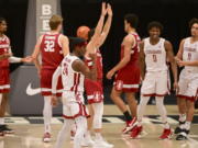 Washington State guard Noah Williams (24) reacts after scoring a basket while being fouled by Stanford guard Michael O&#039;Connell (5) during the first half of an NCAA college basketball game, Saturday, Feb. 20, 2021, in Pullman, Wash.