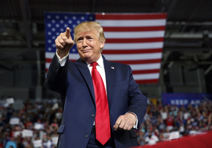 FILE - In this Wednesday, July 17, 2019 file photo, President Donald Trump gestures to the crowd as he arrives to speak at a campaign rally at Williams Arena in Greenville, N.C. Donald Trump&#039;s first impeachment trial centered on a phone call that Americans never heard with the leader of a country far away, Ukraine. His second was far different. It centered on the rage, violence and anguish of one day in Washington itself. Together the two impeachment trials Trump faced illustrated his ability to escape consequences for actions that even many Republicans denounced.