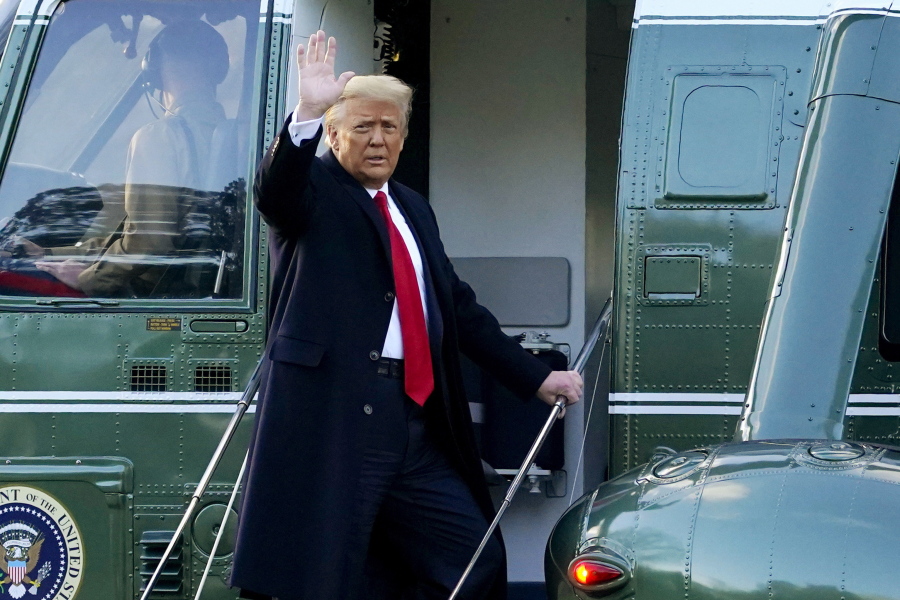 FILE - In this Wednesday, Jan. 20, 2021, file photo, President Donald Trump waves as he boards Marine One on the South Lawn of the White House, in Washington, en route to his Mar-a-Lago Florida Resort. Former President Trump has named two lawyers to his impeachment defense team, one day after it was revealed that the former president had parted ways with an earlier set of attorneys.