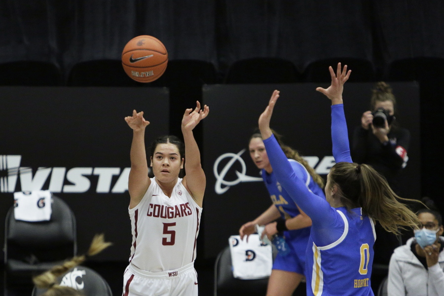 Washington State guard Charlisse Leger-Walker (5) shoots next to UCLA guard Chantel Horvat (0) during the first half of an NCAA college basketball game in Pullman, Wash., Friday, Feb. 5, 2021.