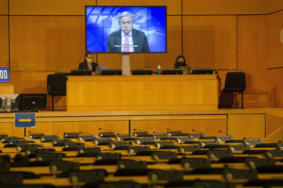 A screen shows U.N. Secretary-General Antonio Guterres making his statement by video, during the opening of the 46th session of the Human Rights Council, at the European headquarters of the United Nations in Geneva, Switzerland, Monday Feb. 22, 2021.