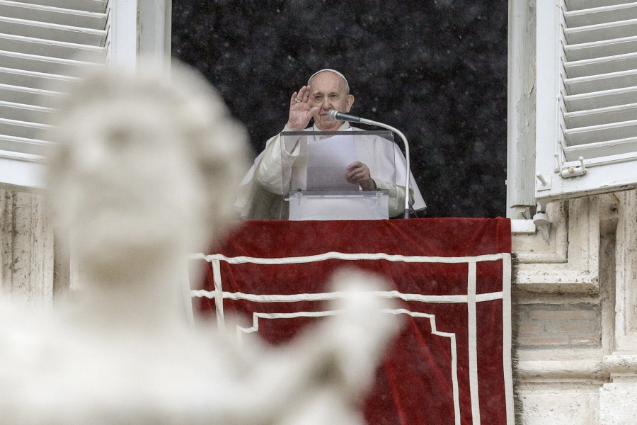 Pope Francis delivers his blessing from his studio window overlooking St. Peter&#039;s Square, at the Vatican, Sunday, Feb. 7, 2021.