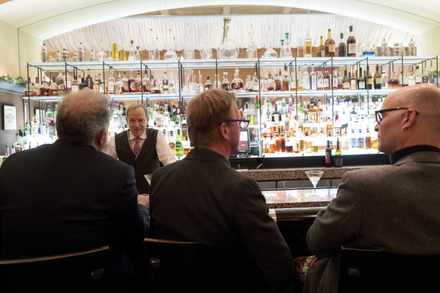 In this Tuesday, Nov. 27, 2018, photo, a bartender talks to a customer at the Gotham Bar and Grill in New York. The Manhattan upscale restaurant hopes to reopen by summer 2021 if government regulations permit, but will likely have just 35 staffers instead of the 100 the restaurant had before it closed in March 2020.