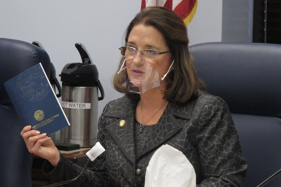 FILE - In this Wednesday, Jan. 27, 2021 file photo, Alaska state Sen. Lora Reinbold, an Eagle River Republican, holds a copy of the Alaska Constitution during a committee hearing in Juneau, Alaska. Reinbold has been a vocal critic, along with other lawmakers, of Gov. Mike Dunleavy&#039;s disaster declarations while the Legislature was not in session. She has used her committee to amplify voices of those who question the effectiveness of masks and the usefulness of the government&#039;s emergency response. In a scathing letter that included references to her Facebook posts, Dunleavy accused Reinbold of misrepresenting the state&#039;s COVID-19 response and deceiving the public.